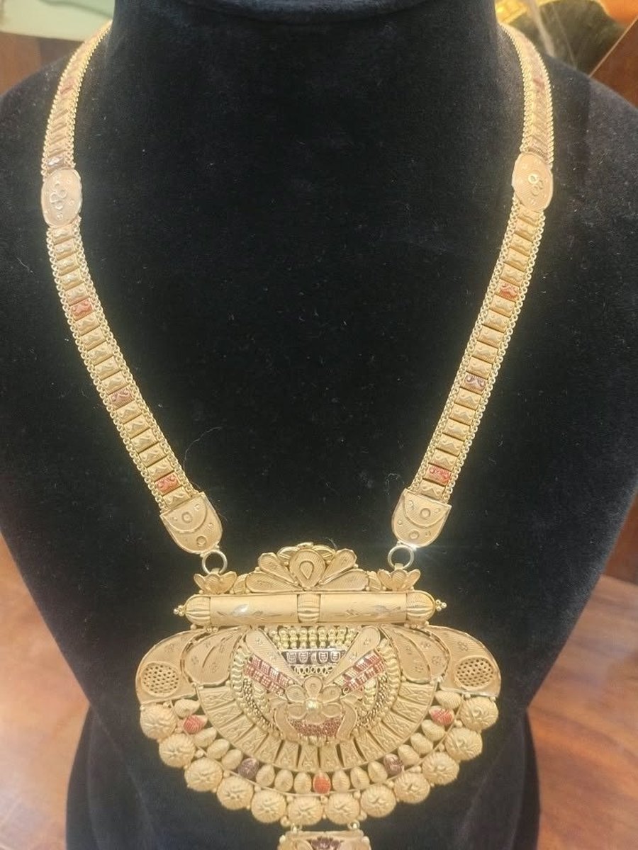 Long gold necklace, before